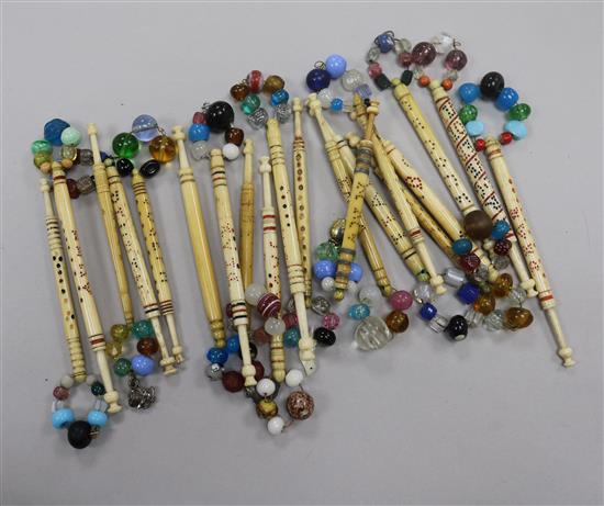 A collection of approximately twenty 19th century named bone and ivory lace bobbins